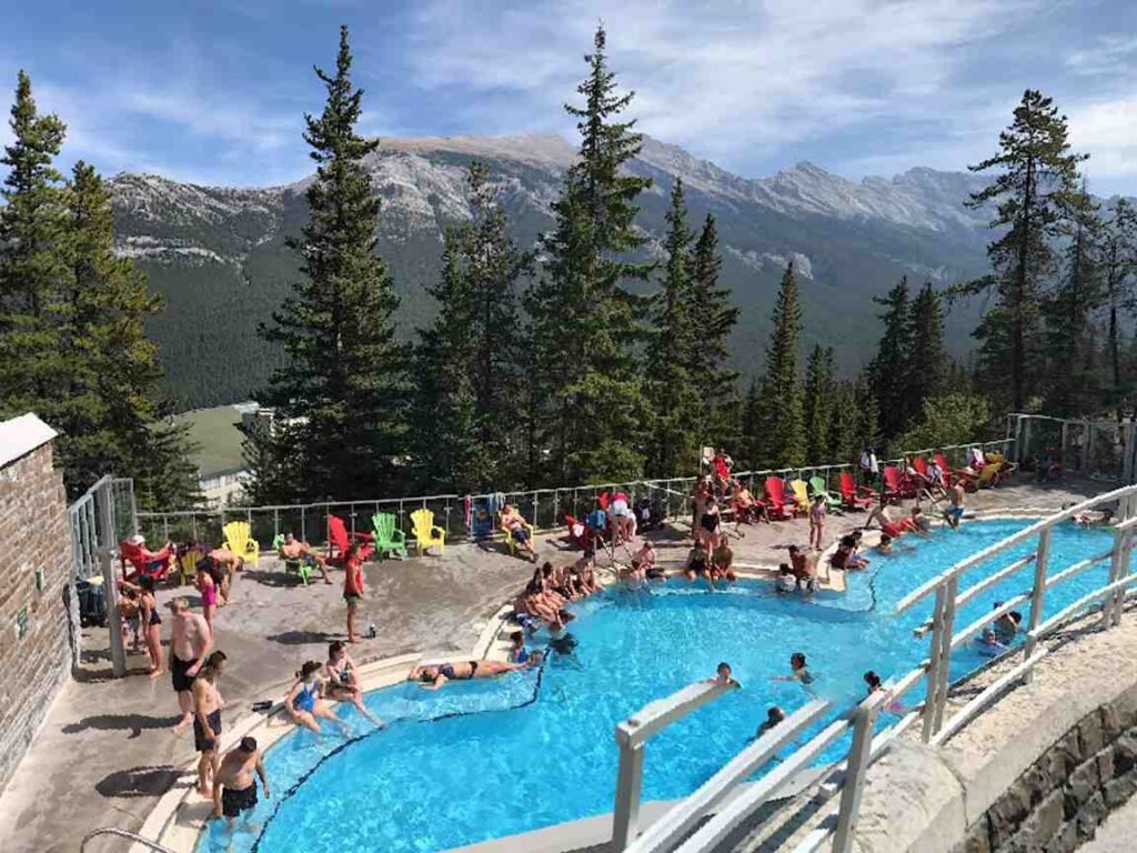 Stunning view of Banff Upper Hot Springs pool with Mount Rundle in the background on a clear day