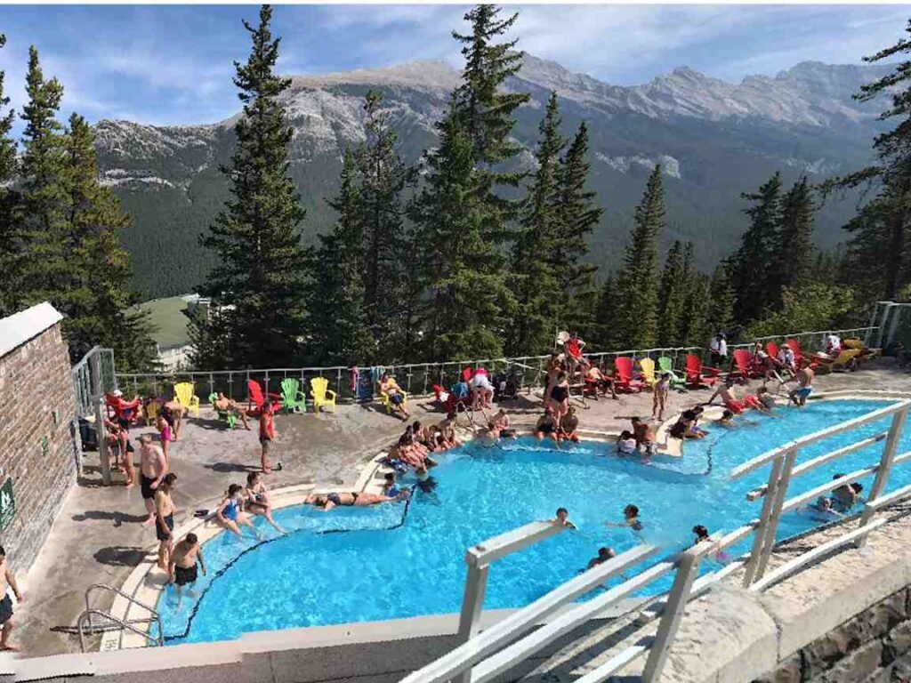 Summer fun at Banff Upper Hot Springs under clear skies and warm sunshine